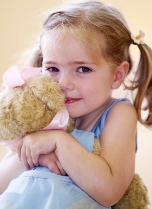 Toddler dancing with Melody Bear