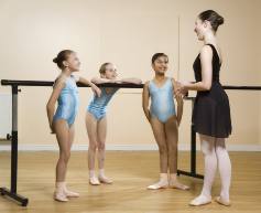 Image of two boys and two girls in an arabesque