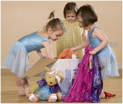 Photo of dancers with a dressing-up box